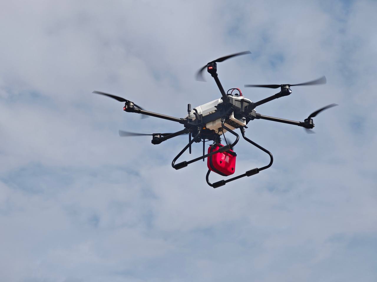 ARC Airis drone carrying emergency equipment in flight