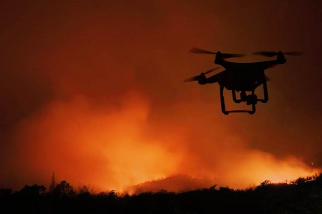 ARC drone providing aerial awareness above an active wildfire